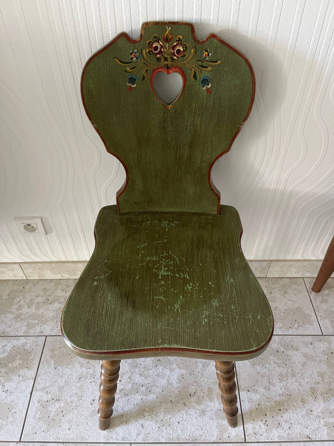 Wooden dressing table with olive green chair and floral patterns