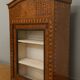 Antique Louis XV display cabinet with geometric marquetry decoration.