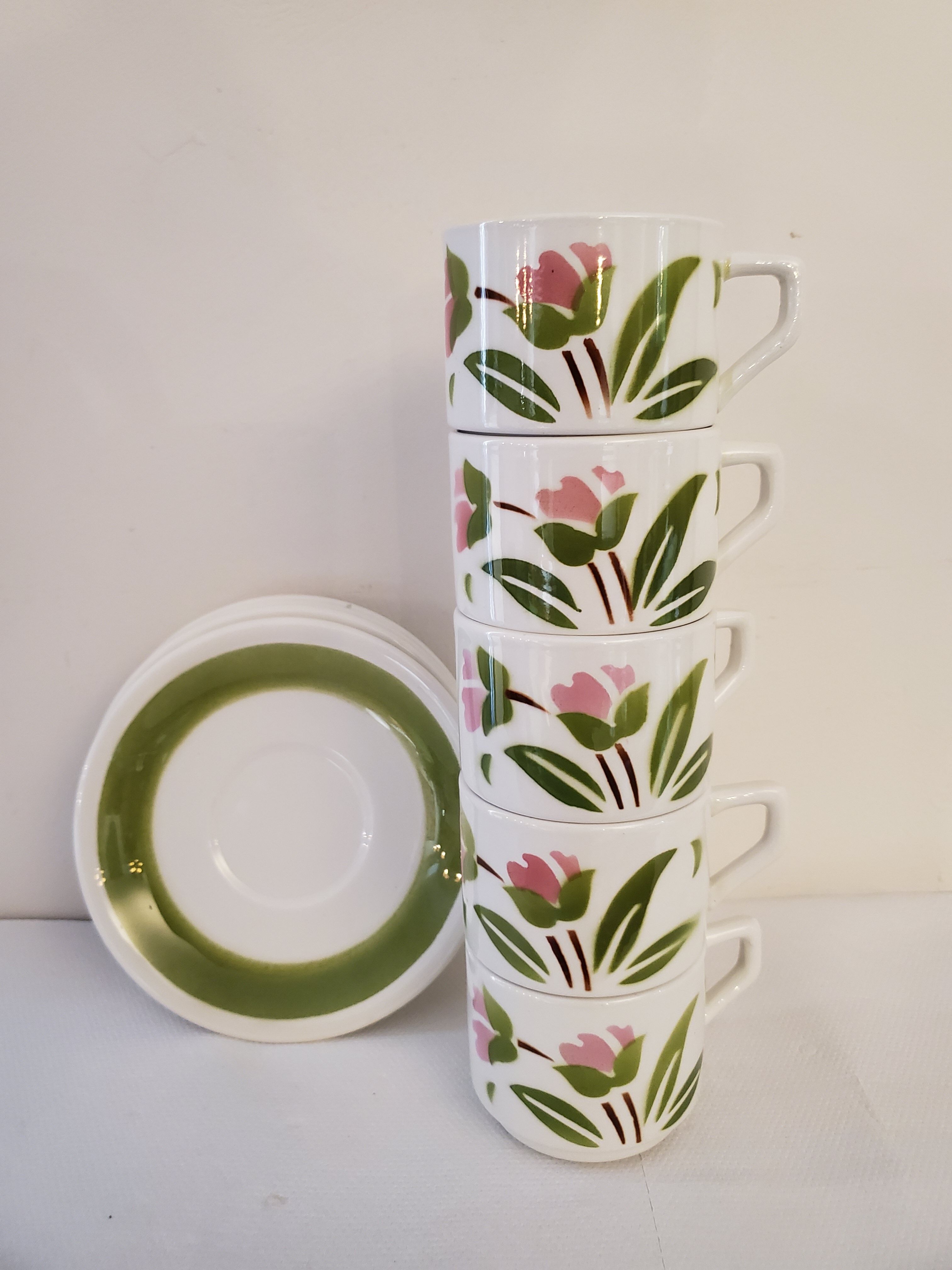 5 cups and ceramic saucers