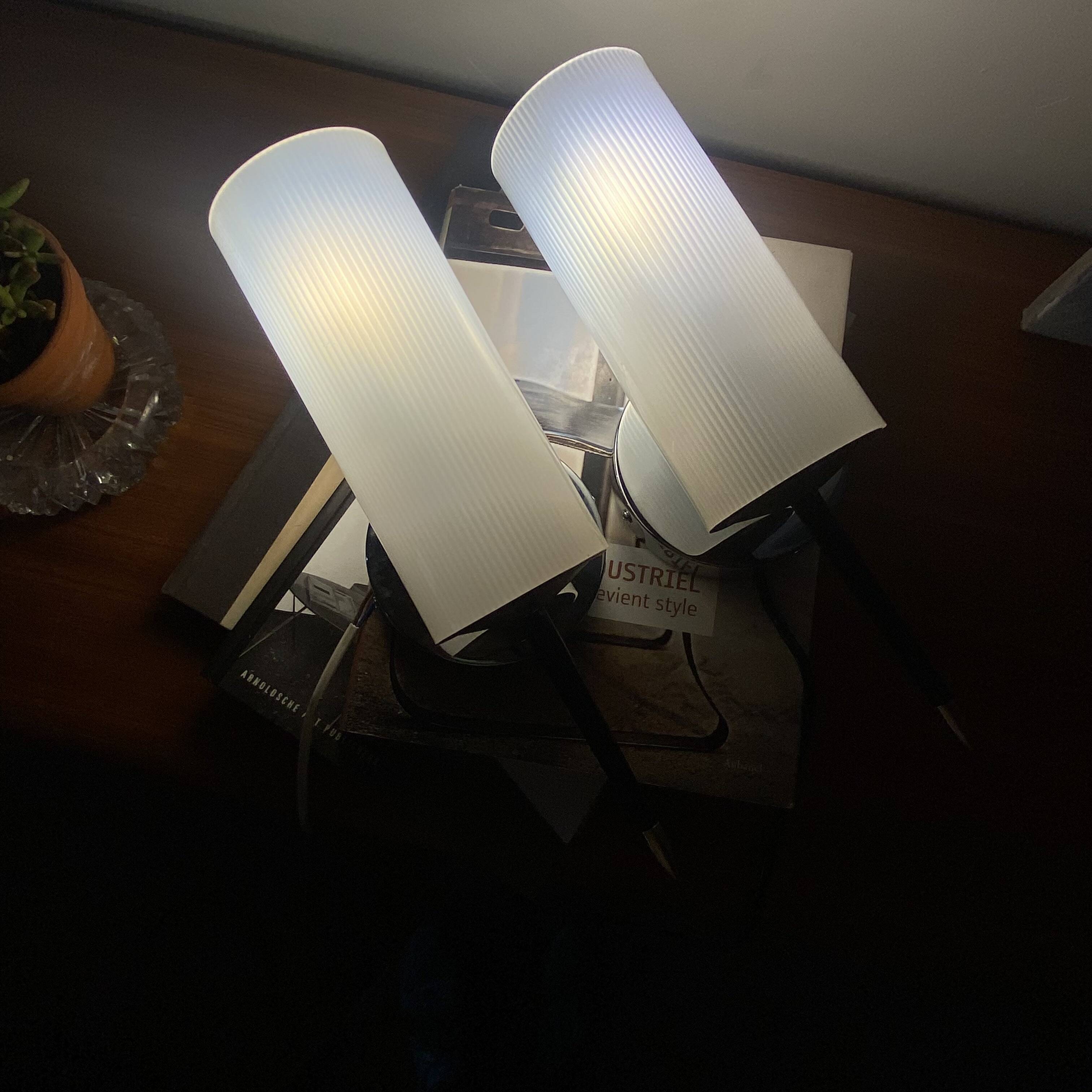 Pair of vintage wall sconces in plexiglass plastic and brass.