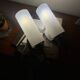 Pair of vintage wall sconces in plexiglass plastic and brass.