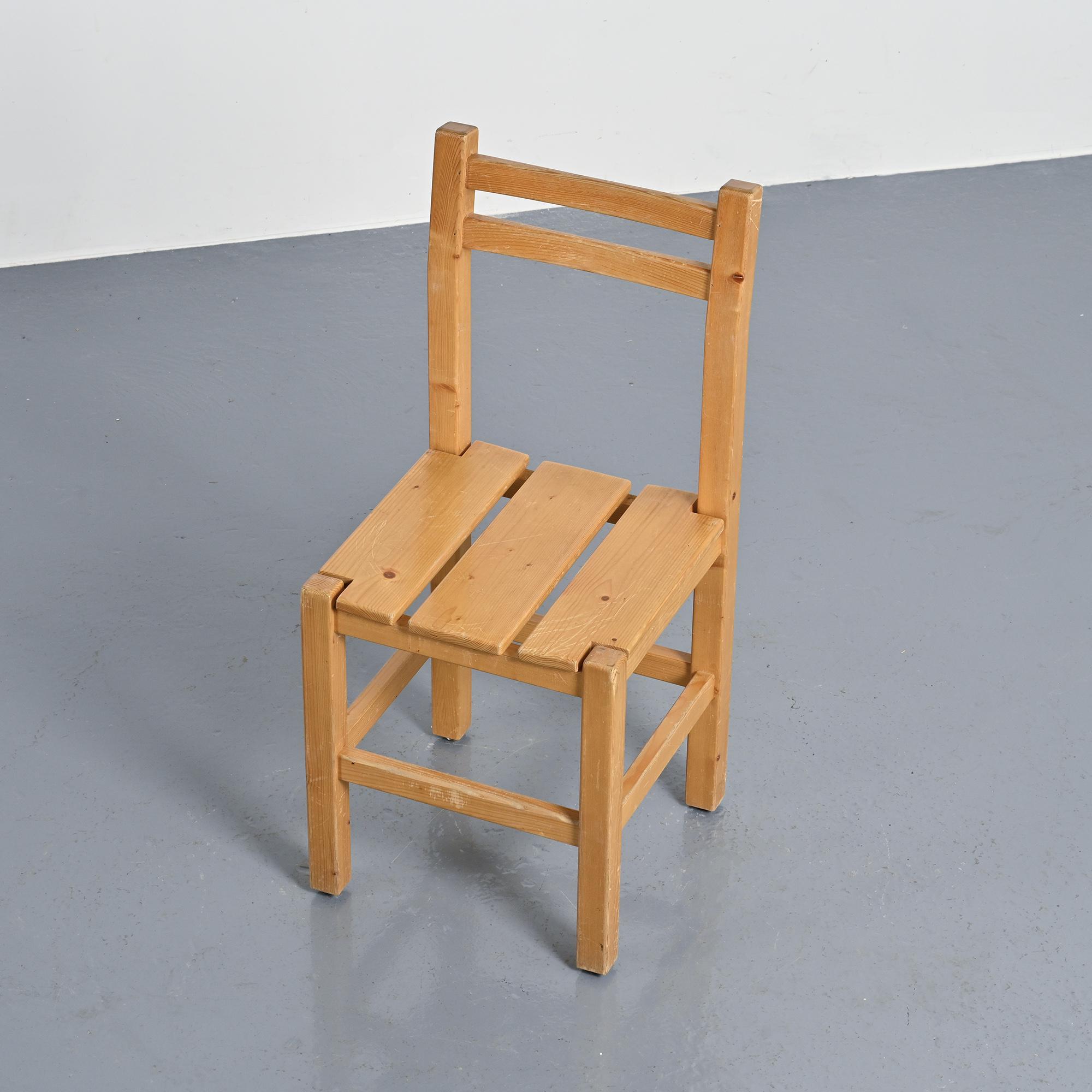 Set of four solid pine chairs by Maison Regain.
