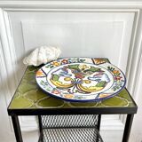 Decorative ceramic plate with griffins
