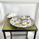Decorative ceramic plate with griffins