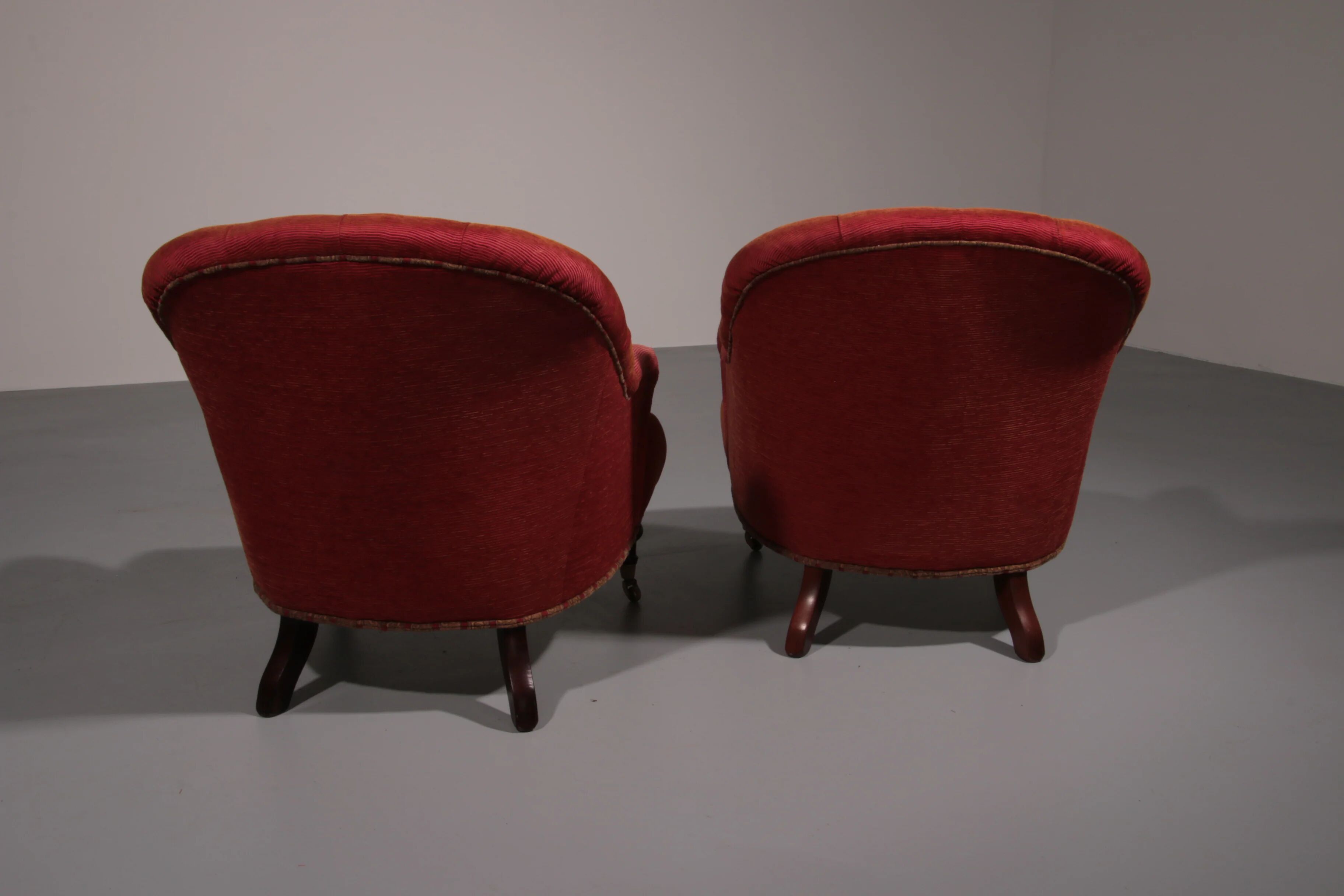 Pair of French red fabric button back armchairs