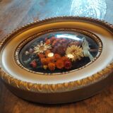 Oval frame with gold patina dried flowers