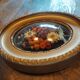 Oval frame with gold patina dried flowers