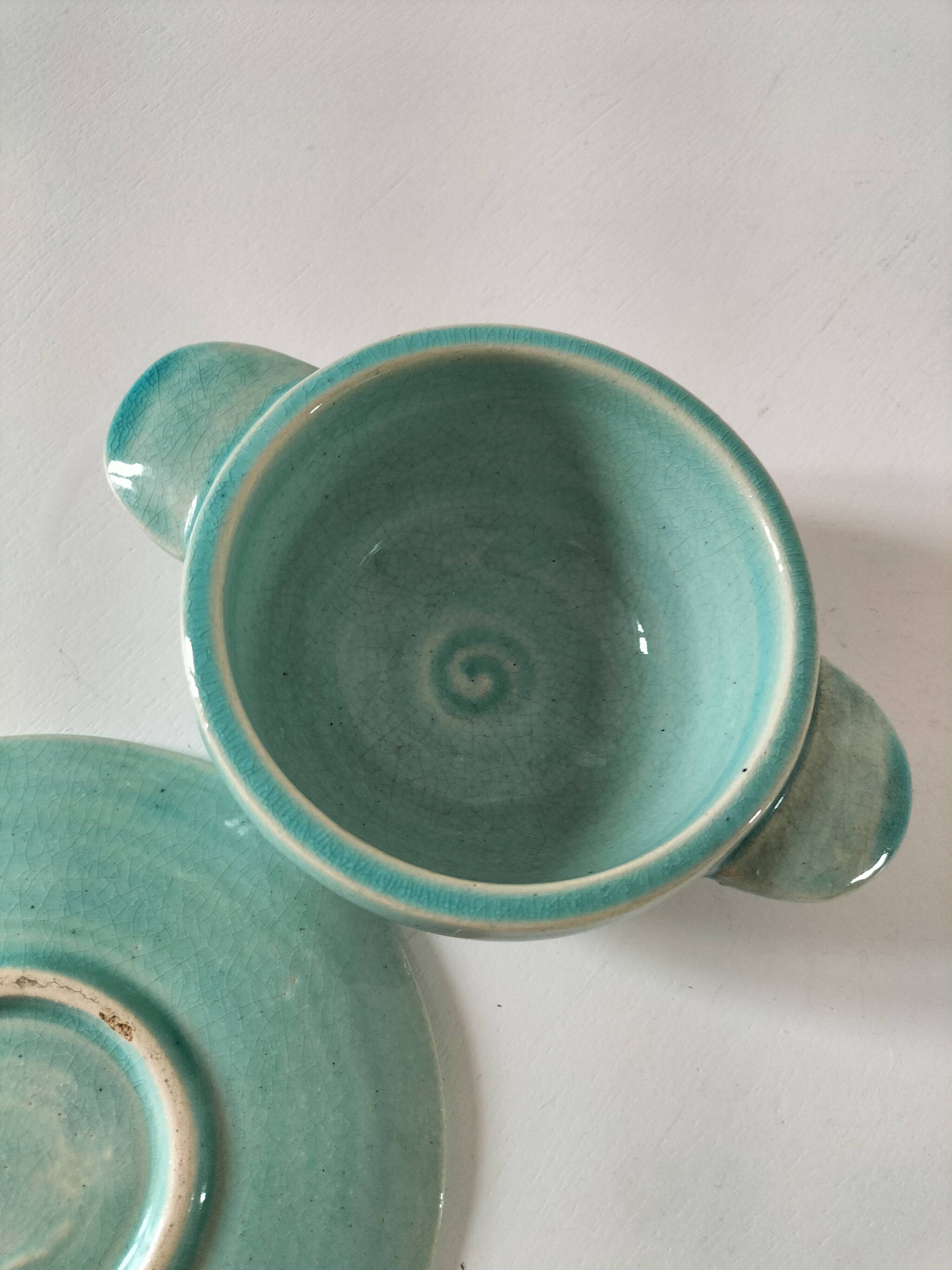 Earthenware bowl and saucer in glazed water green ceramic.