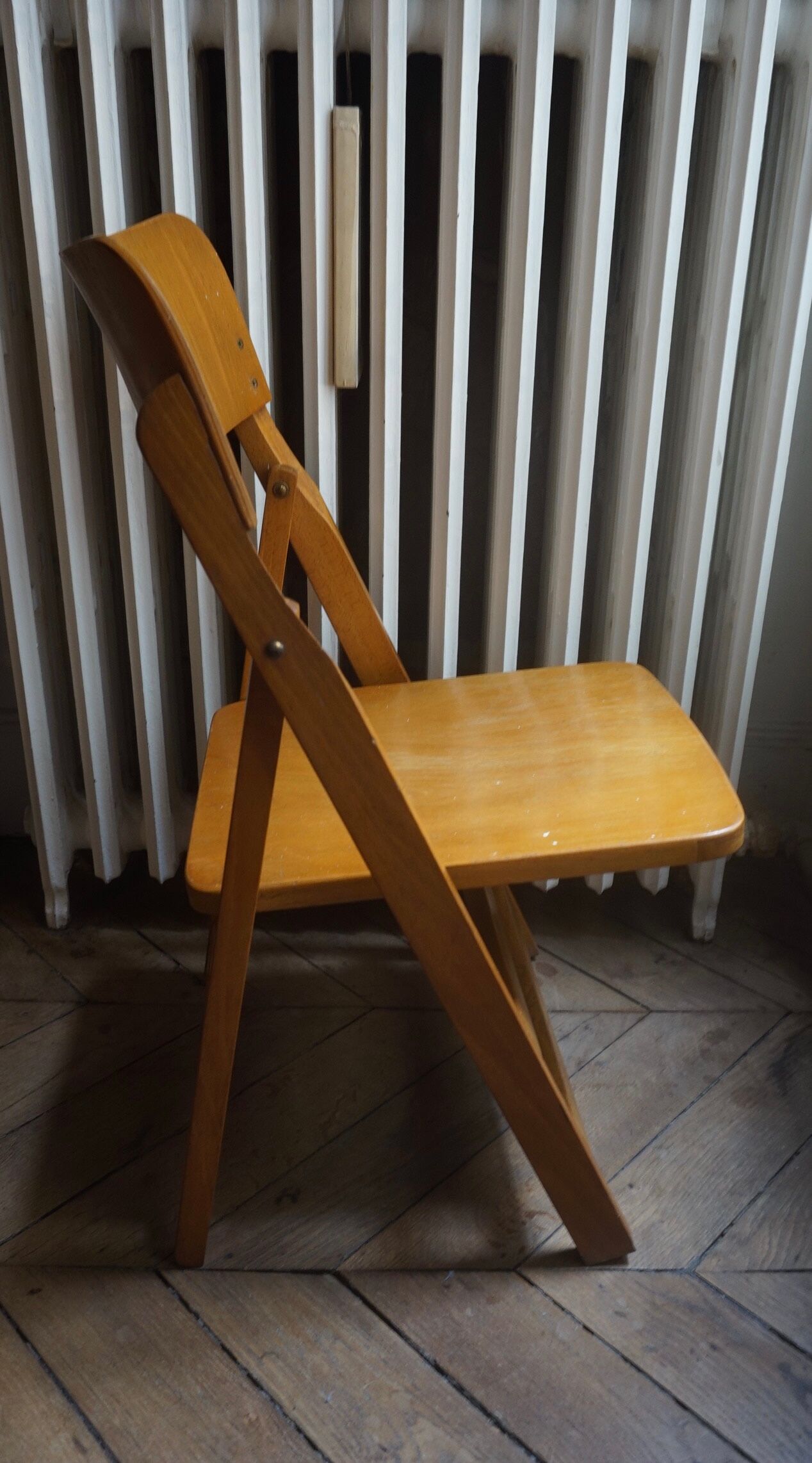 Vintage folding wooden heater chair