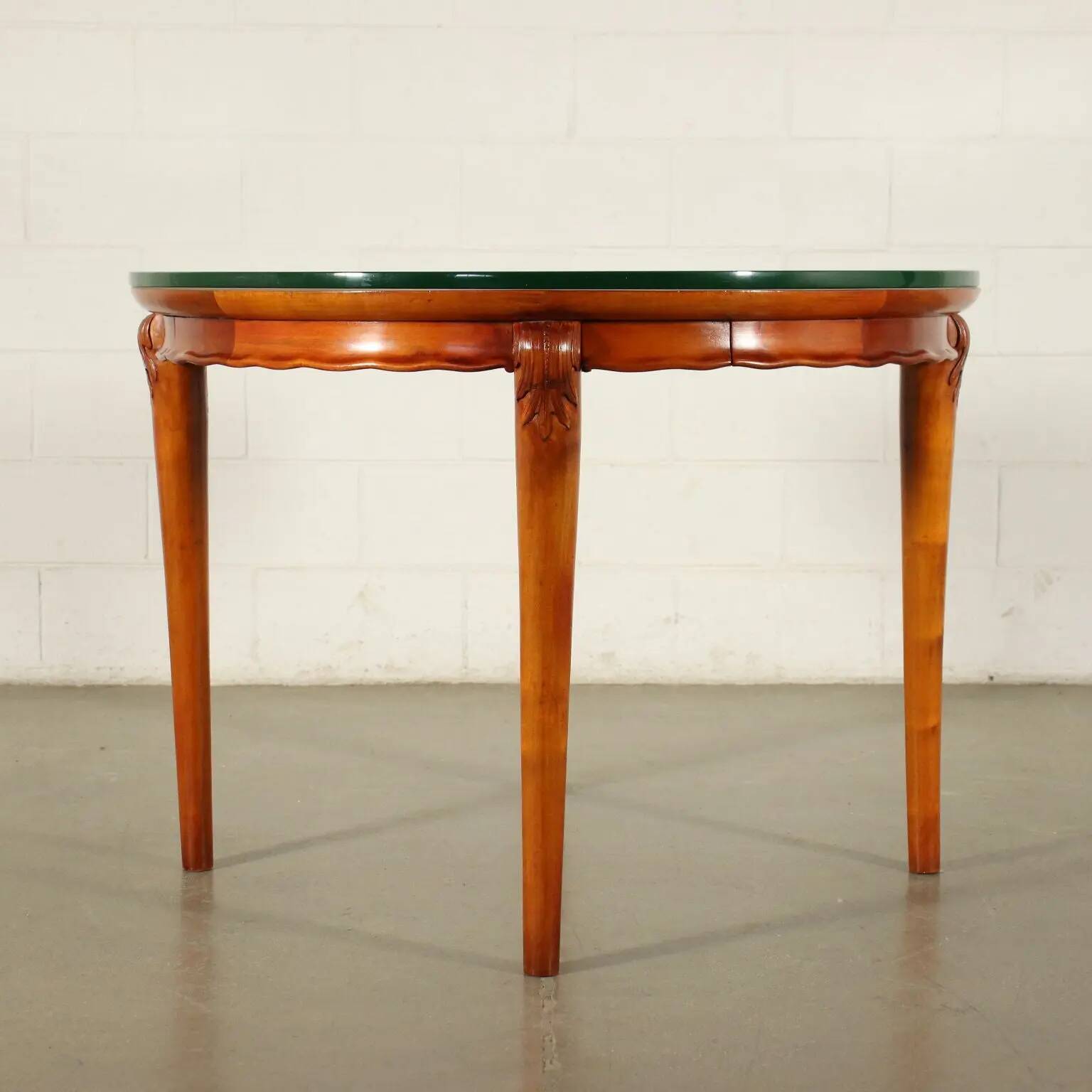Table in solid beech, mahogany veneer and glass, Italy, 1950s.