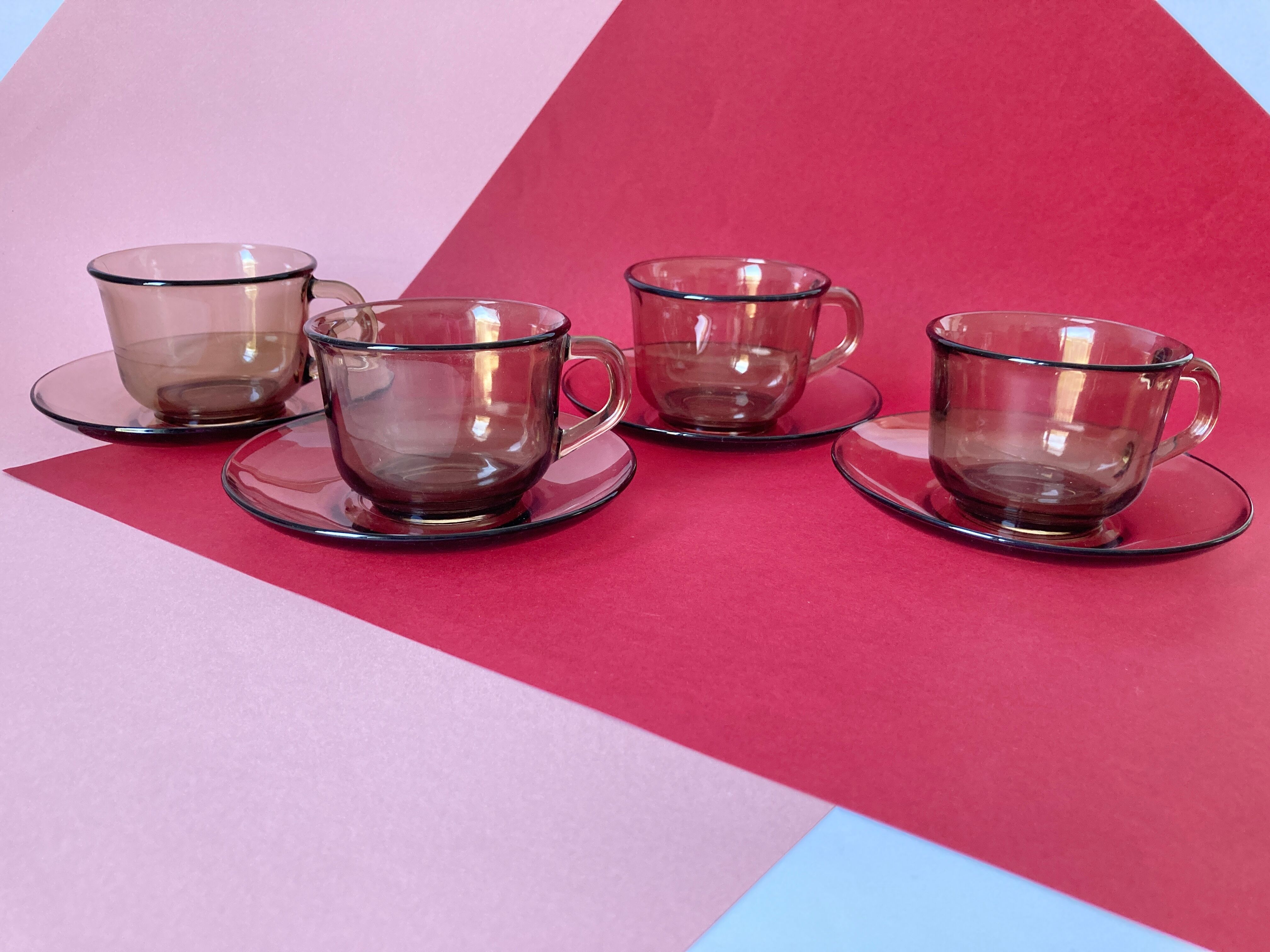 4 Arcoroc coffee cups and saucers in black transparent glass