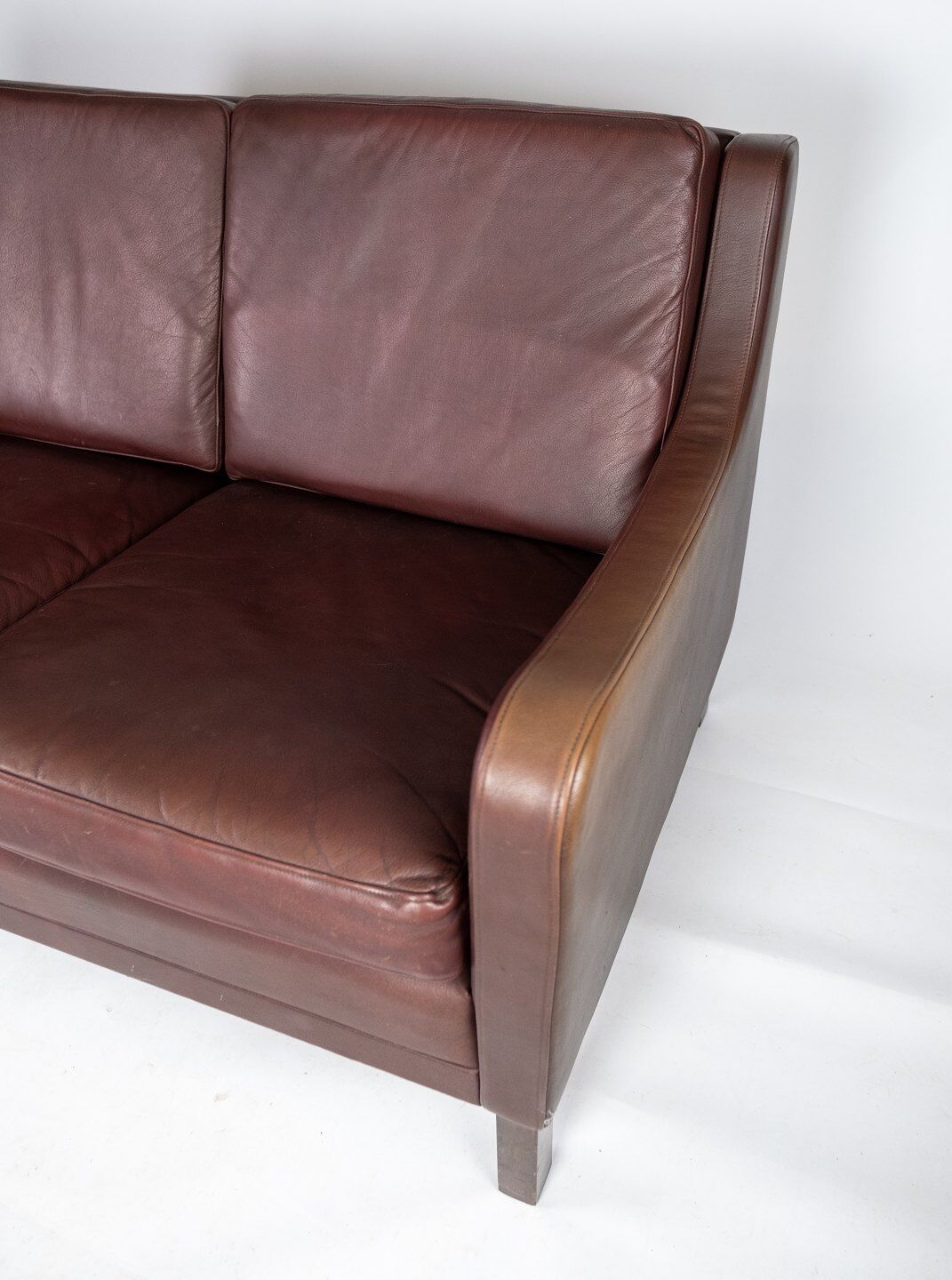 Two seater sofa, with red brown leather by Stouby Furniture