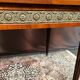 Louis XVI style oval dining table with rosewood marquetry extension mounted in bronze