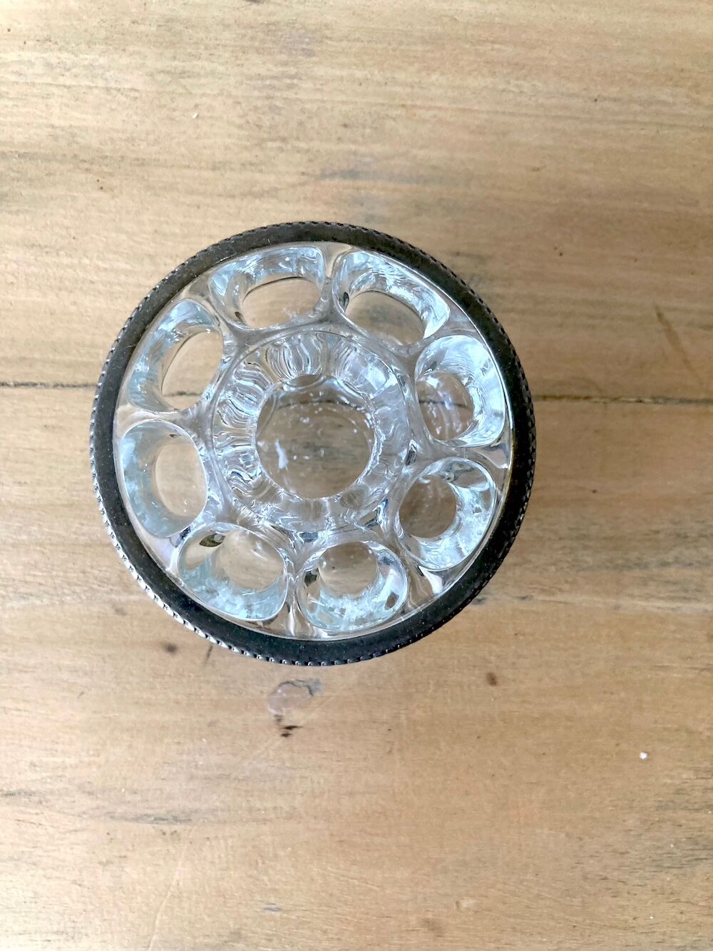 Pique flowers in metal circled glass