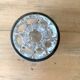 Pique flowers in metal circled glass