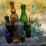 Set of old bottles colored glass