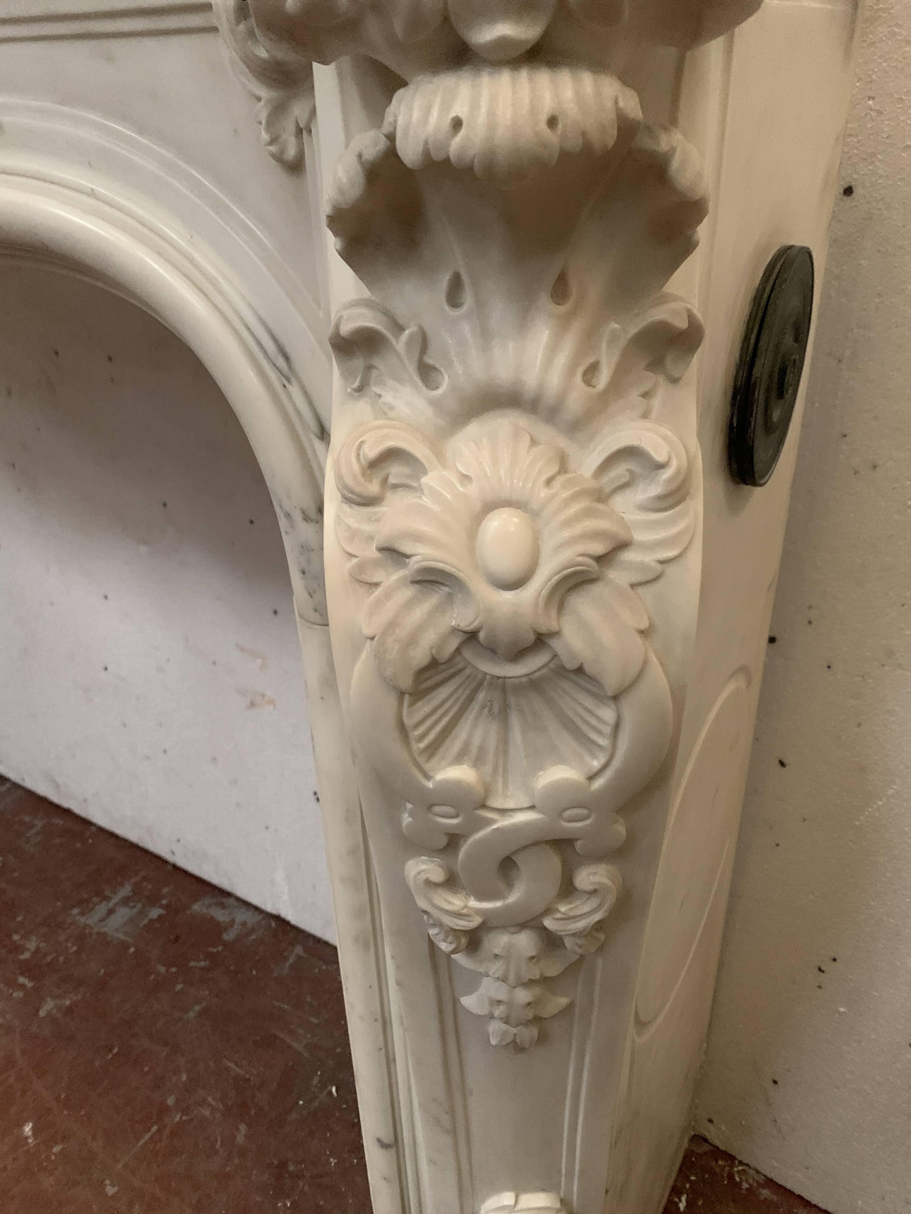 Louis XV style fireplace in white Carrara marble, 19th century