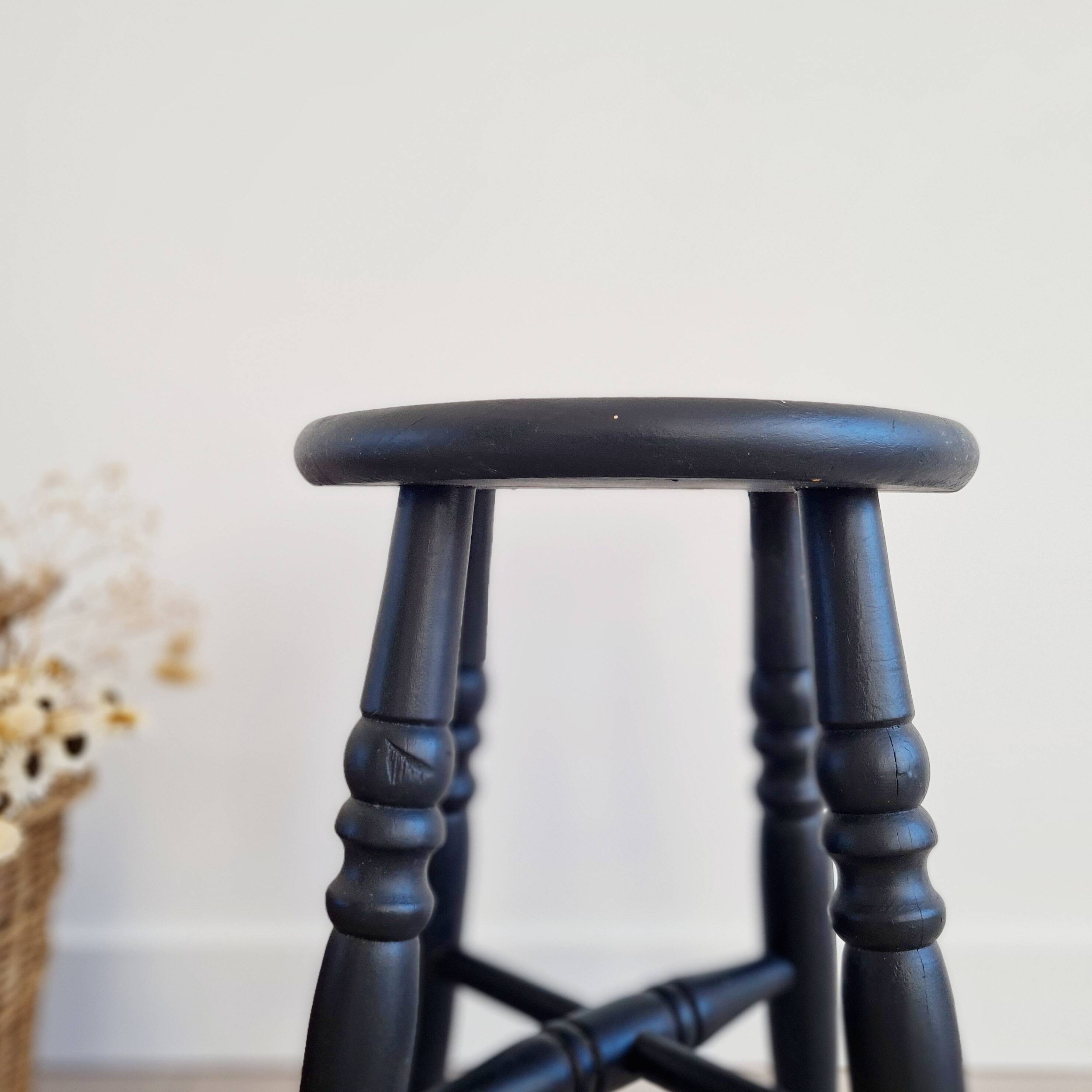 Antique black wooden stool, renovated