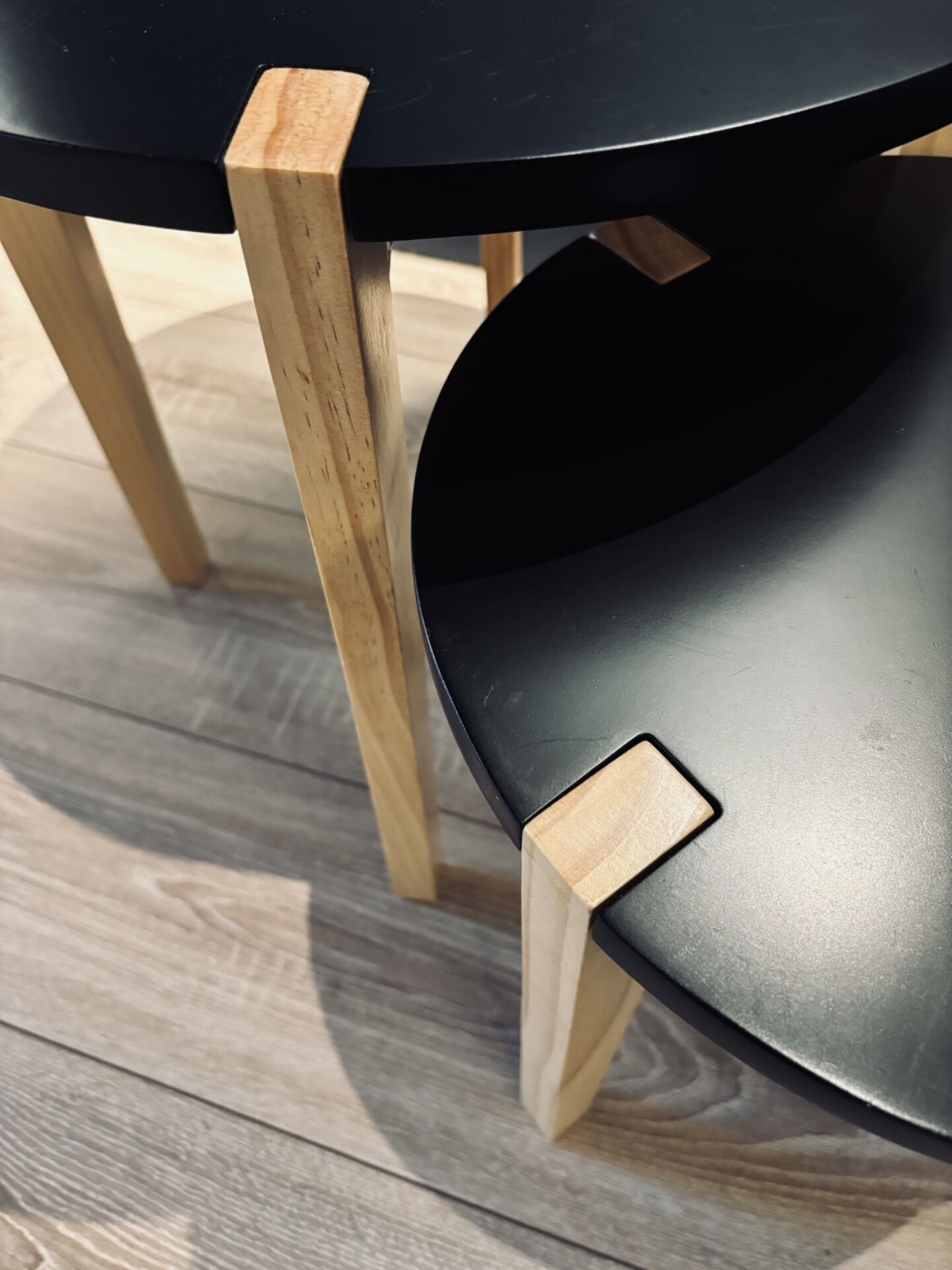 Set of round wooden and black side tables – Scandinavian style