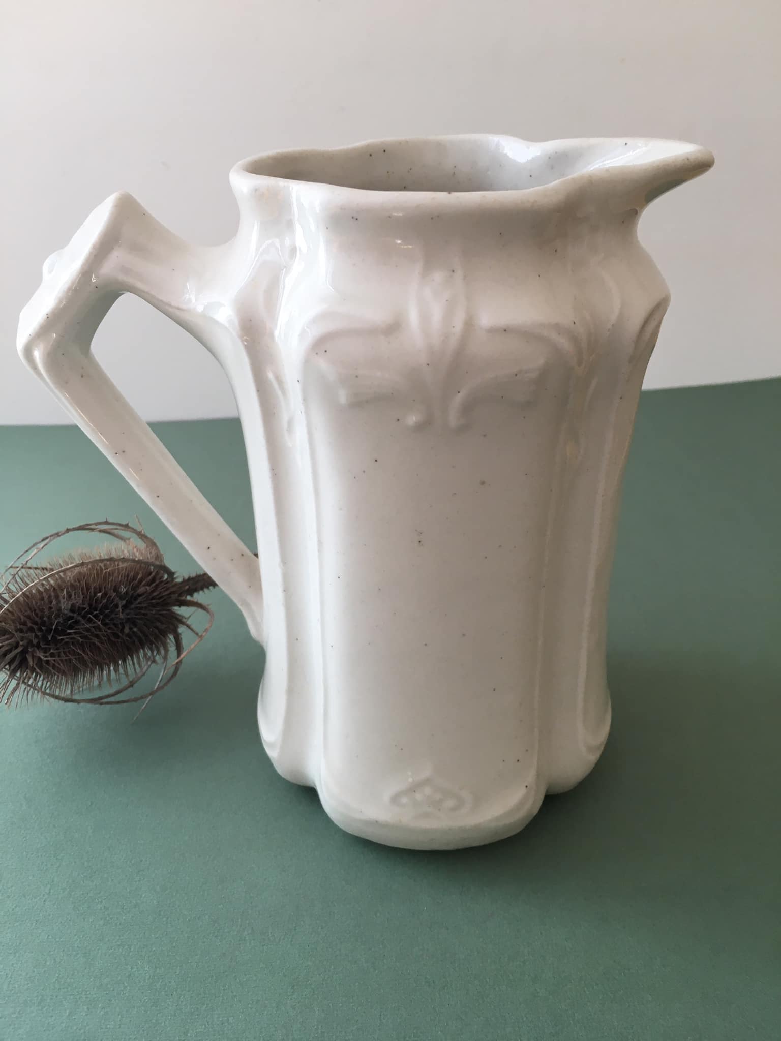 Antique ivory-coloured porcelain vase/pitcher