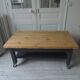 Coffee table on casters, 1 drawer, 1 shelf, re-enchanted in slate gray, wooden top.