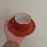 terracotta cups with saucers