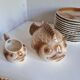 Many flat plates, dish, sauce boat, vegetable dish.