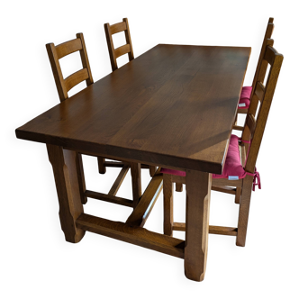 Set of a solid oak farmhouse table from France and its six chairs.