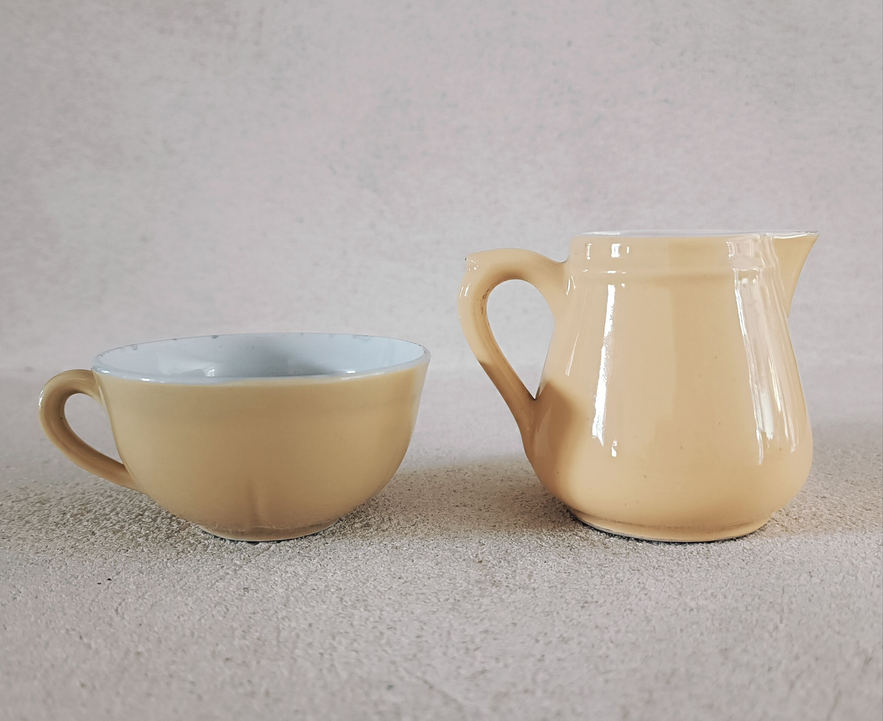 Earthenware cup and milk jar