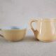Earthenware cup and milk jar