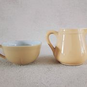 Earthenware cup and milk jar