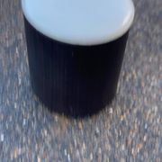 Vintage pouf from the 60s/70s in white and dark brown leather