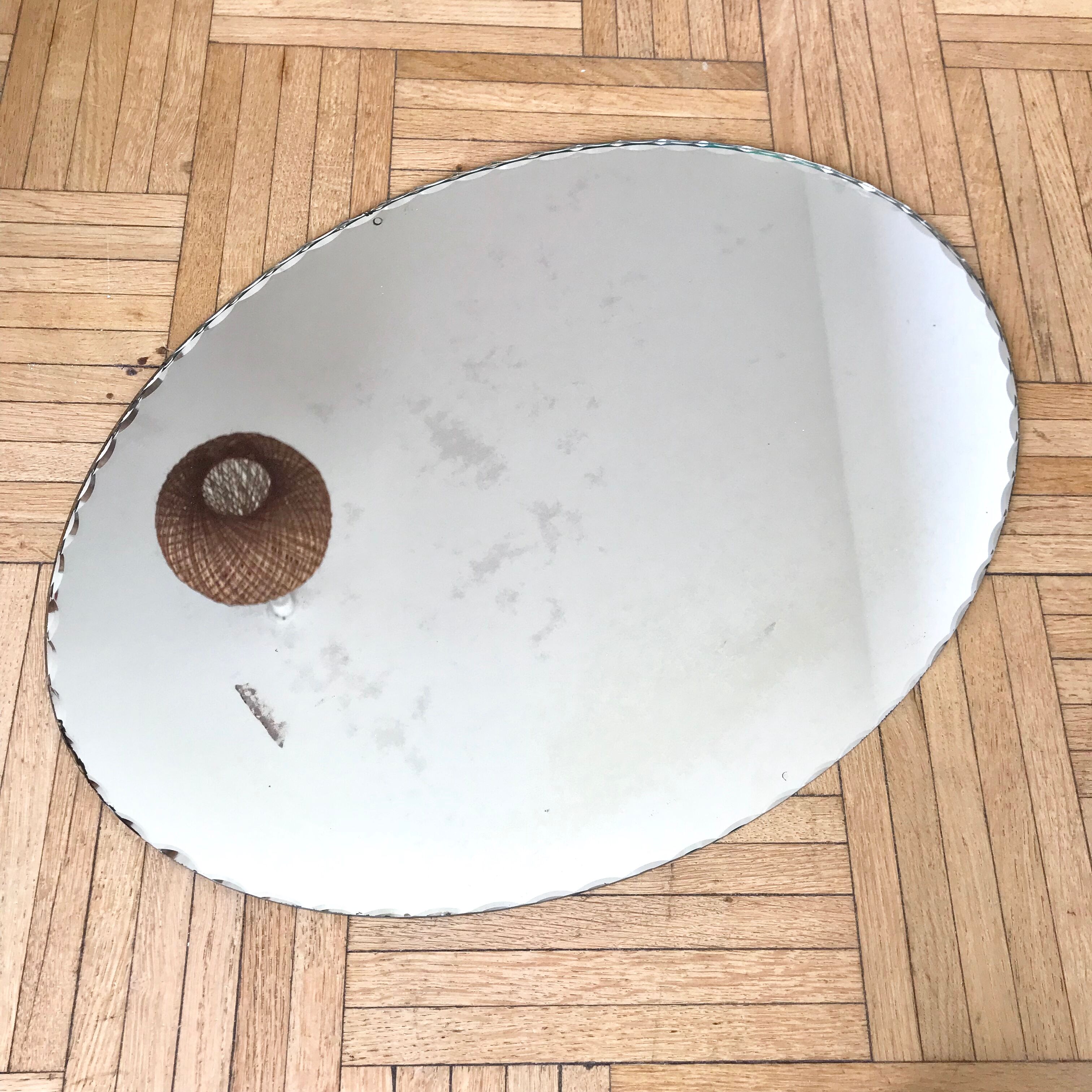Oval mirror bevelled with removable metal media 43x60cm