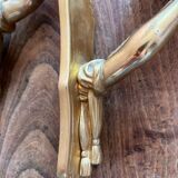 Pair of bronze wall sconces with outstretched arms and hands