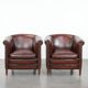 Set of two cow leather club armchairs in a luxurious red/brown colour