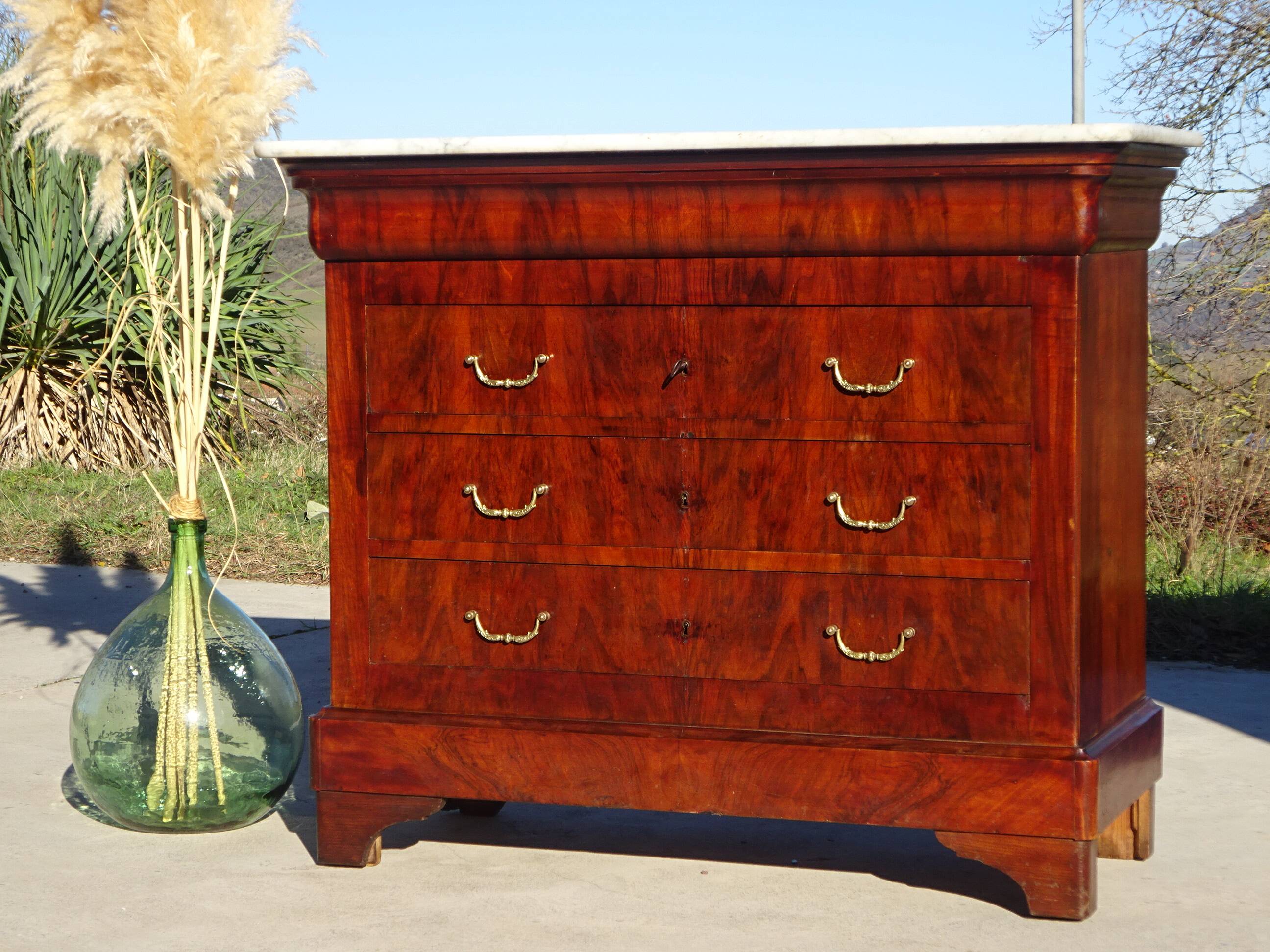 Antique mahogany chest of drawers with white marble.