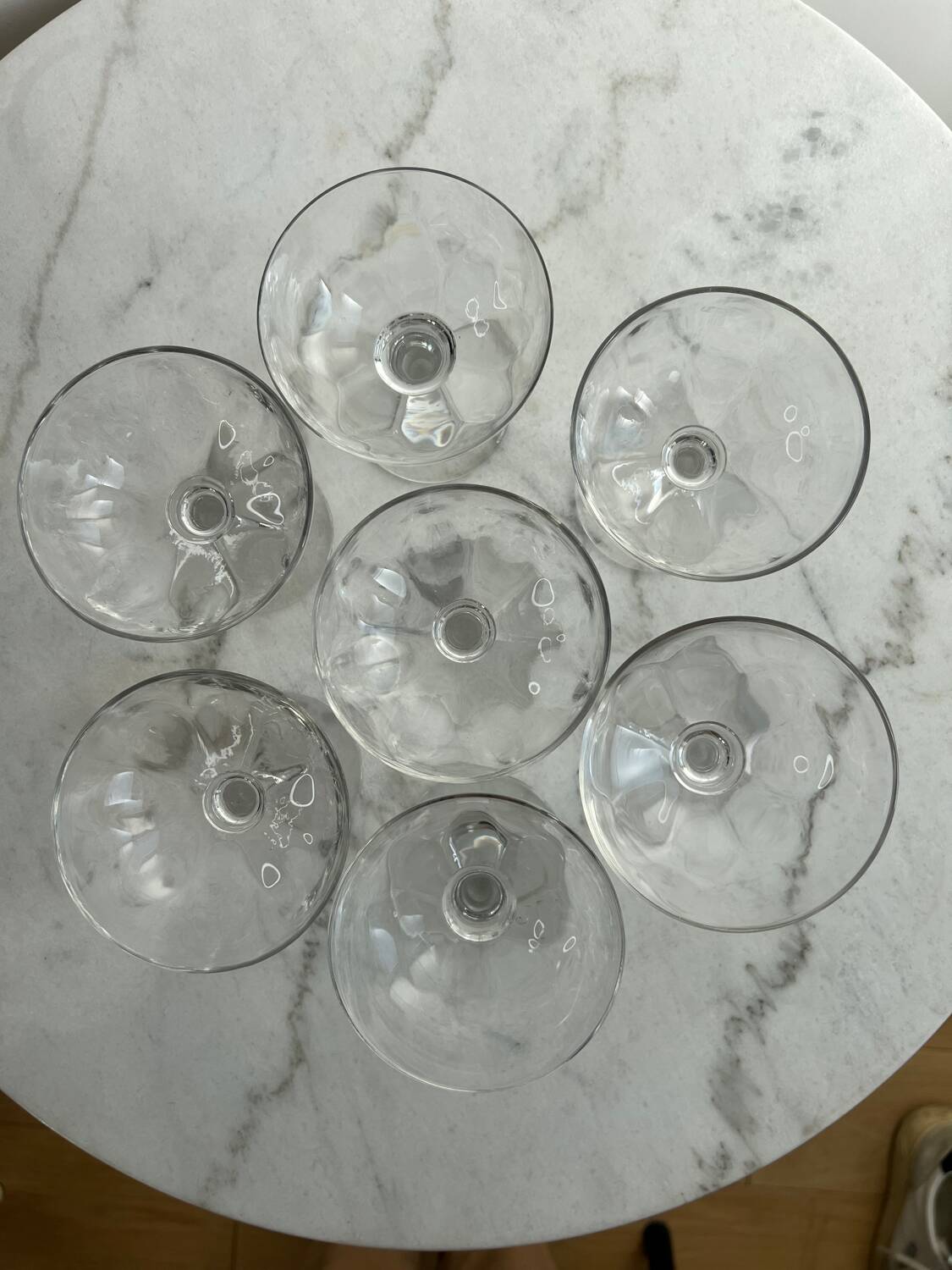 Set of seven blown glass stemmed glasses.
