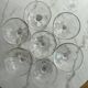 Set of seven blown glass stemmed glasses.
