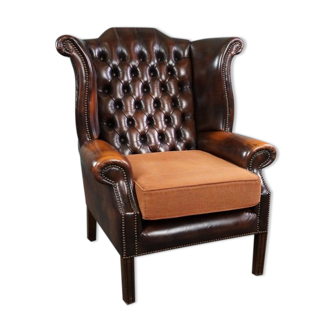 Chesterfield armchair with armrests