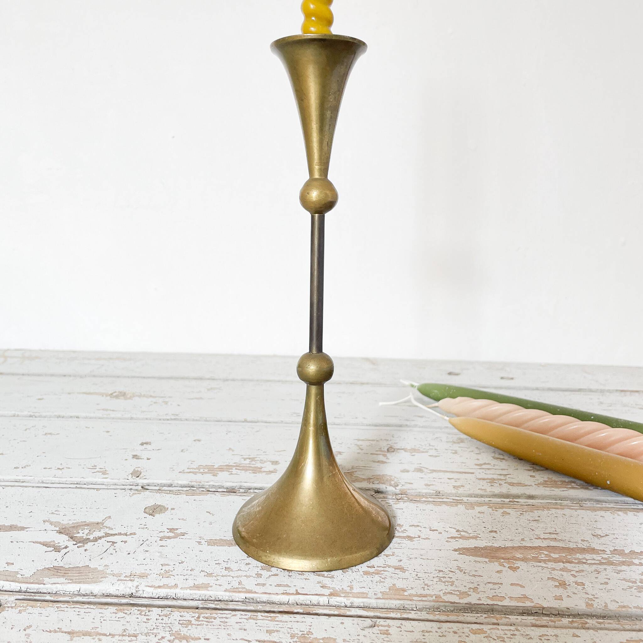 Tapered brass candle holder