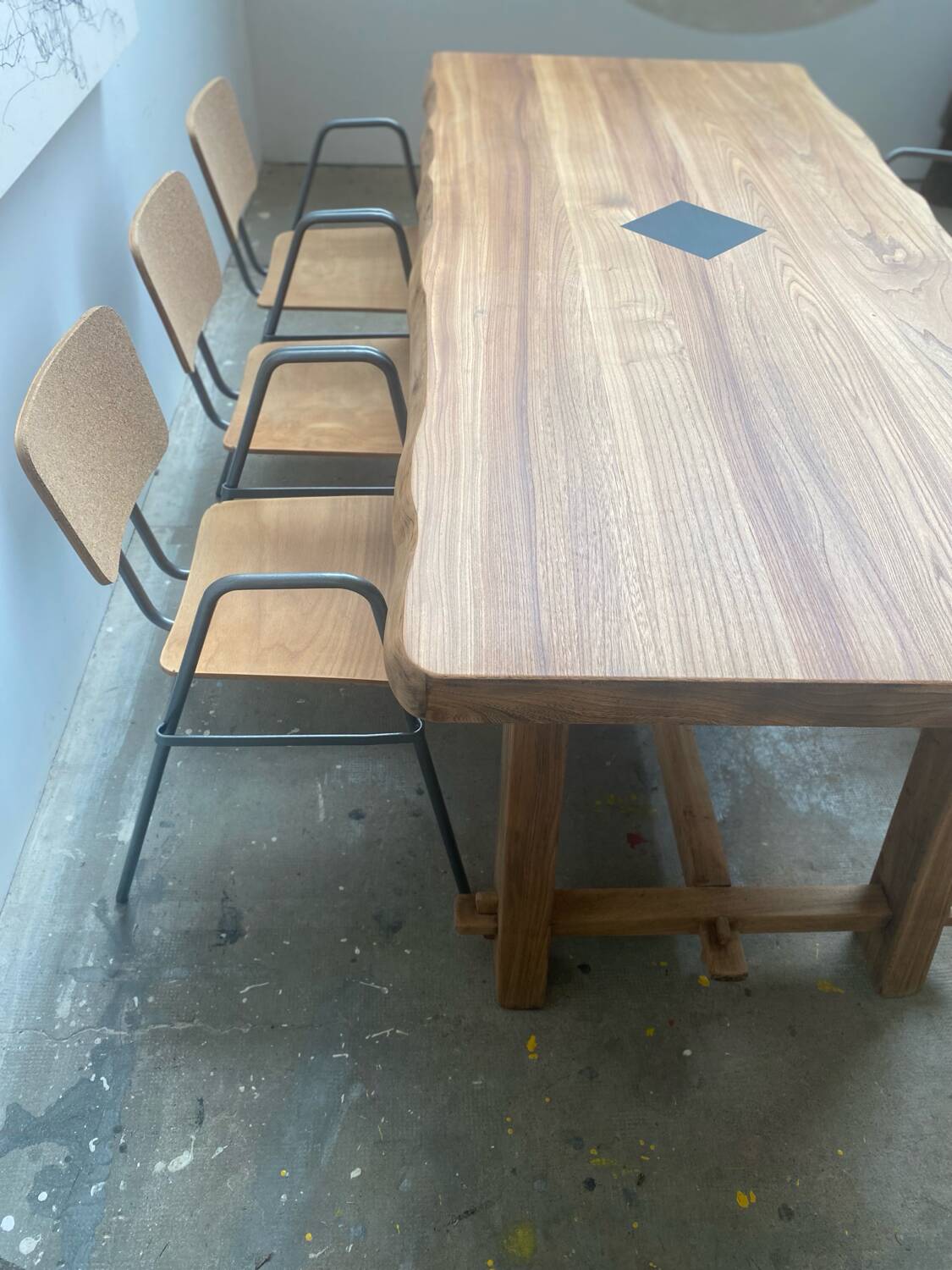 Brutalist Aranjou style table in elm and 6 Stella chairs.