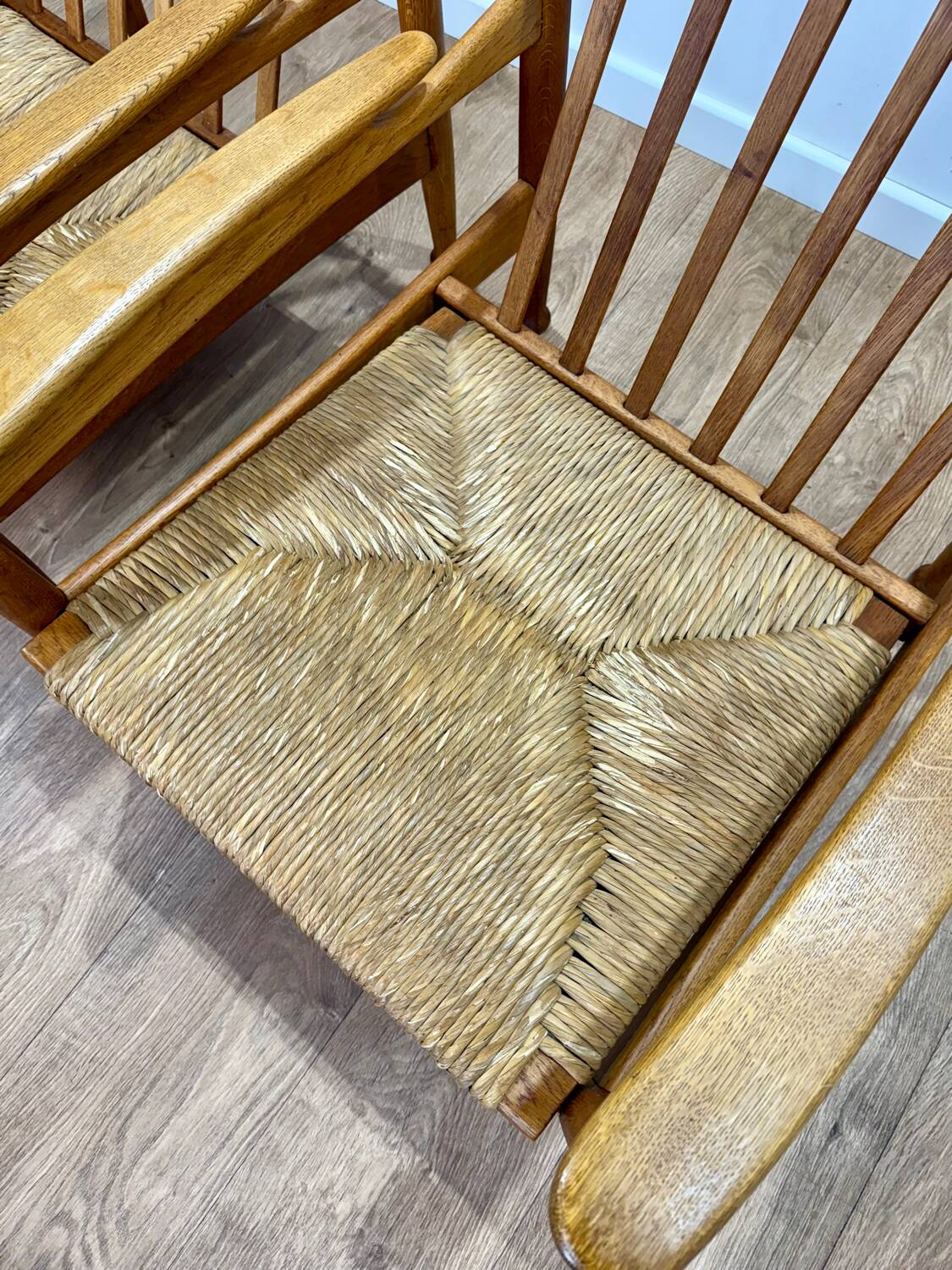 Pair of wooden and straw armchairs