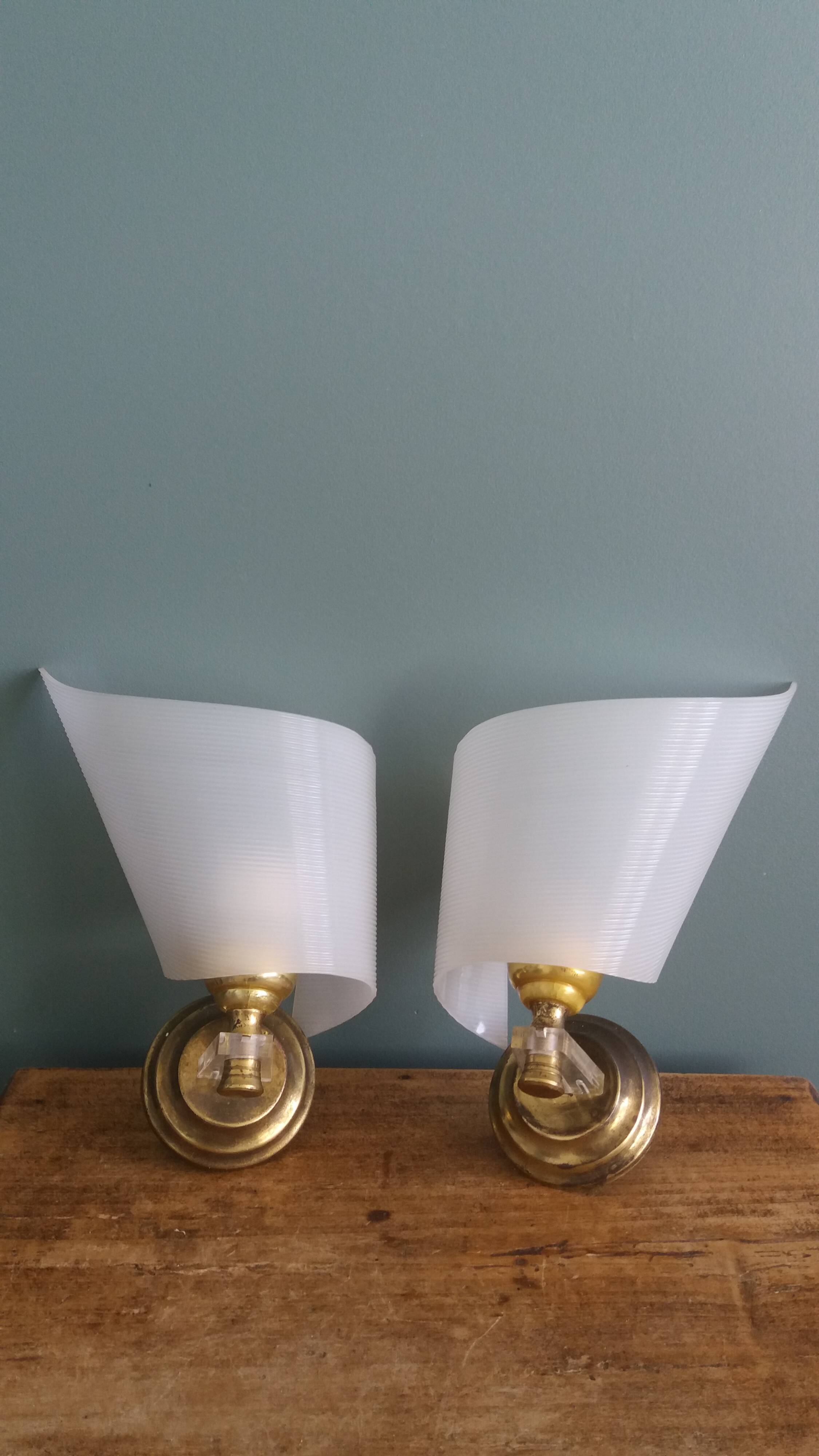 Golden metal appliques and plexiglass perspex in the style of Maison Lunel or Guariche.
