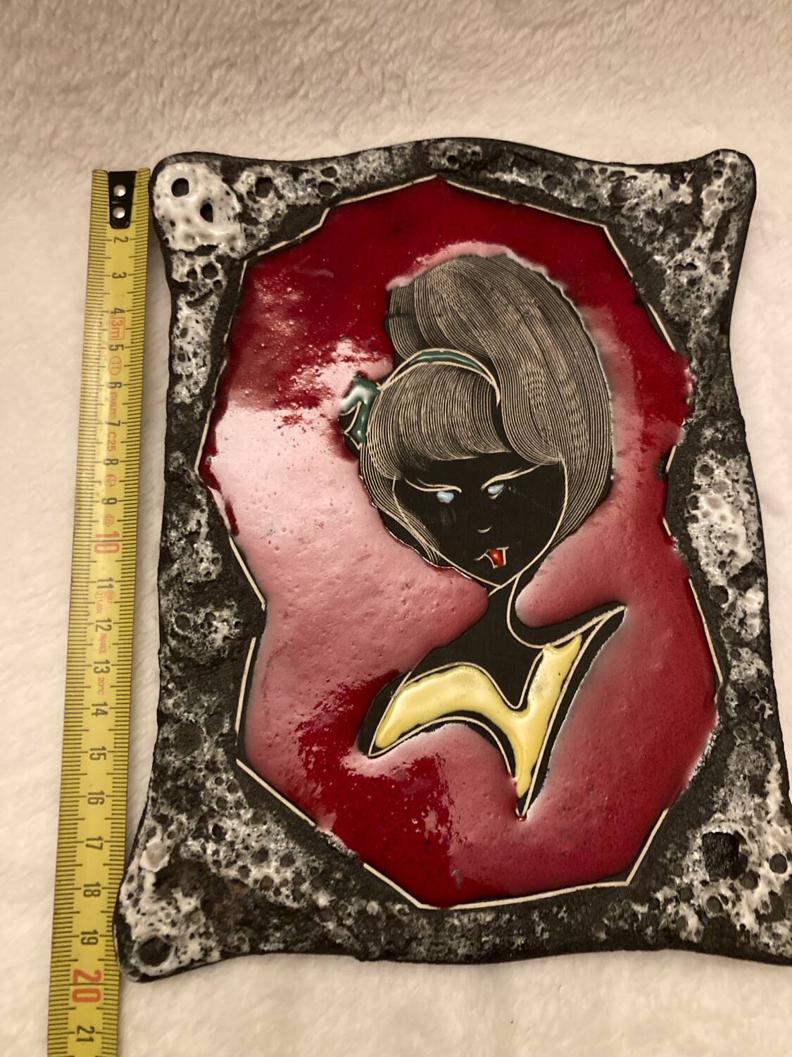 Vintage hanging decorative plate in lava stone