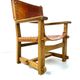 Chaise de château brutaliste ancienne faite à la main en chêne et cuir cognac, années 1920.