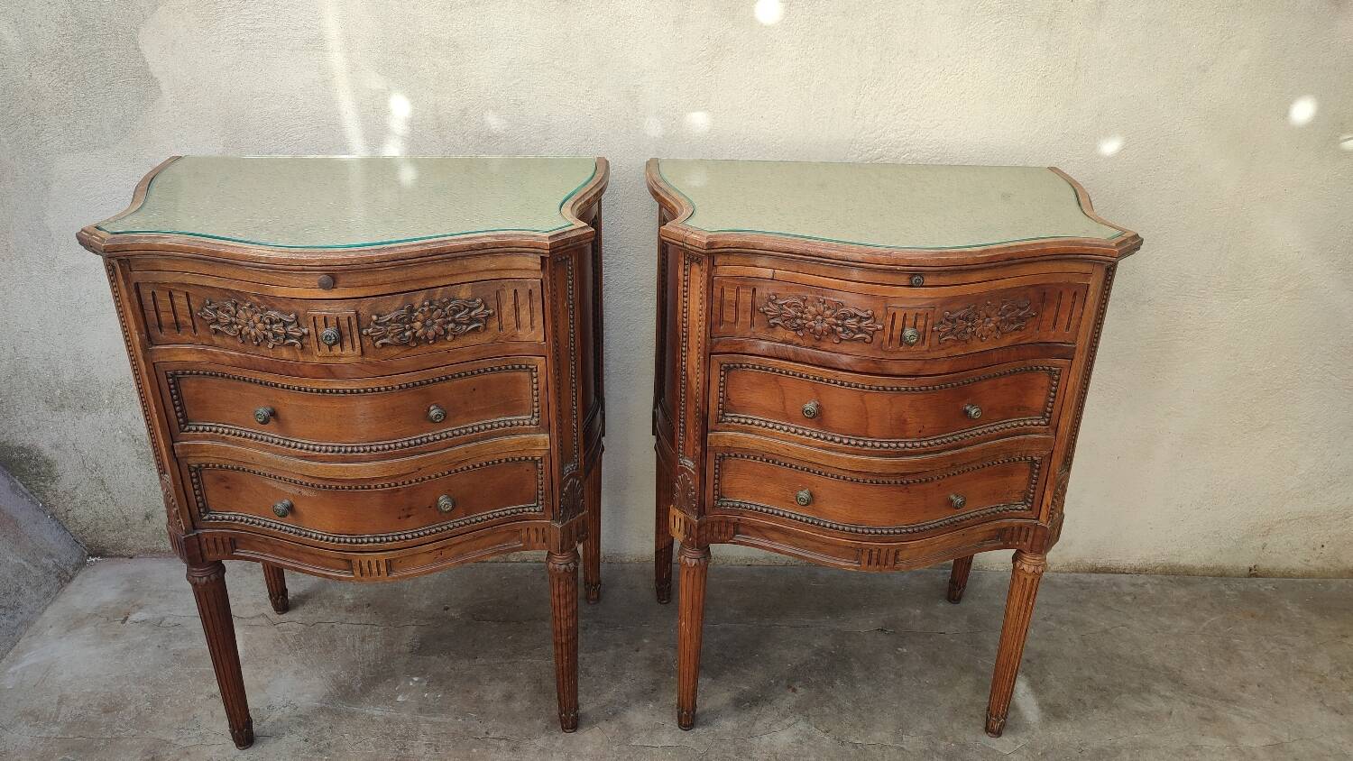 Pair of walnut crossbow chests of drawers