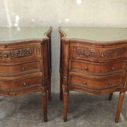 Pair of bow-fronted chests of drawers in walnut