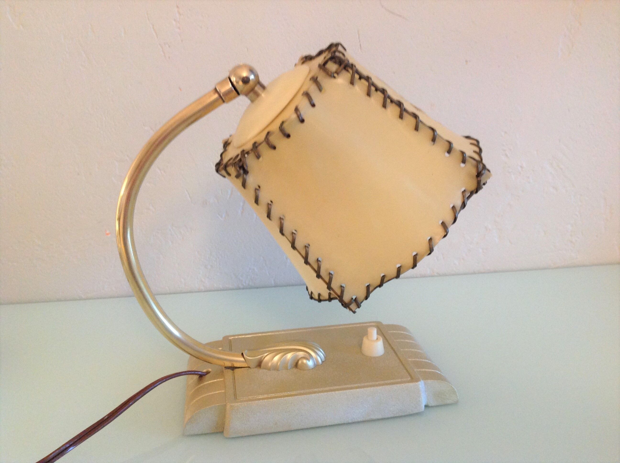 Brass bedside lamp and beige lampshade art deco style