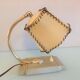 Brass bedside lamp and beige lampshade art deco style
