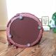 Pouf en velours rose et franges